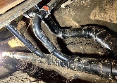 sewer pipe bursting due to root intrusion, emphasizing the need for professional repair services
