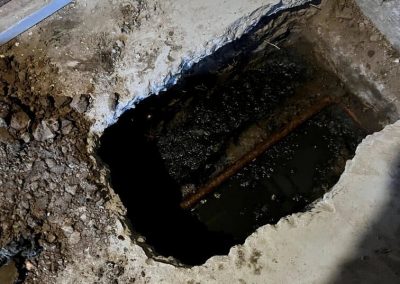 plumber inspecting a sewer line using video technology to identify cracks and blockages