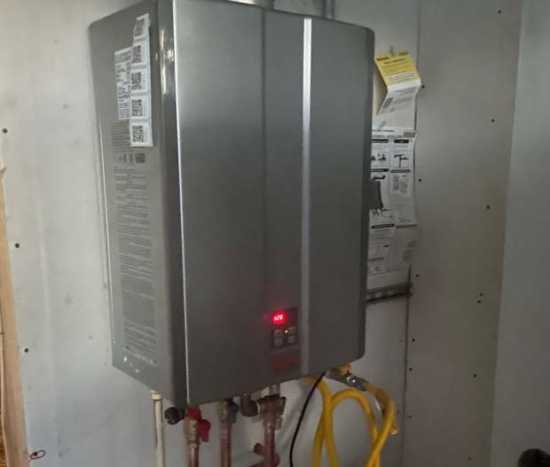 water heater leak detection sensor installed near the base of a unit.