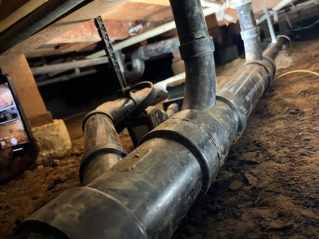 Lead pipe replacement project removing the old service line from the sidewalk.