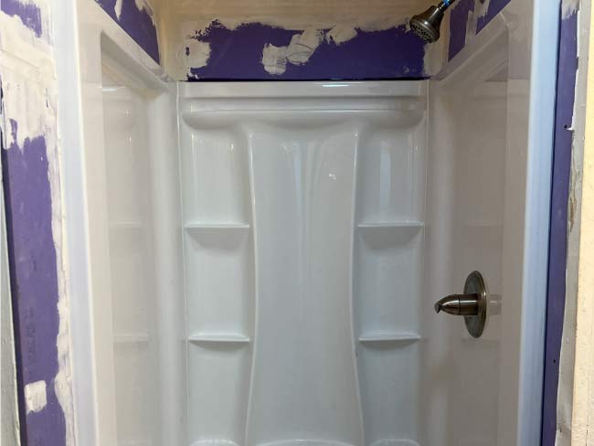 bathroom plumbing replacement of a shower